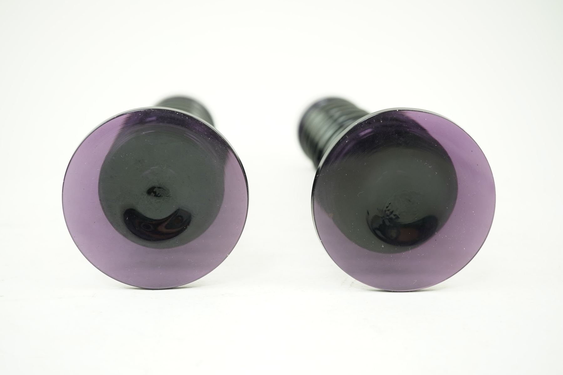 Ronald Stennett-Wilson (1915-2009) for Wedgwood: A pair of nine-ring 'Sheringham' amethyst glass candlesticks